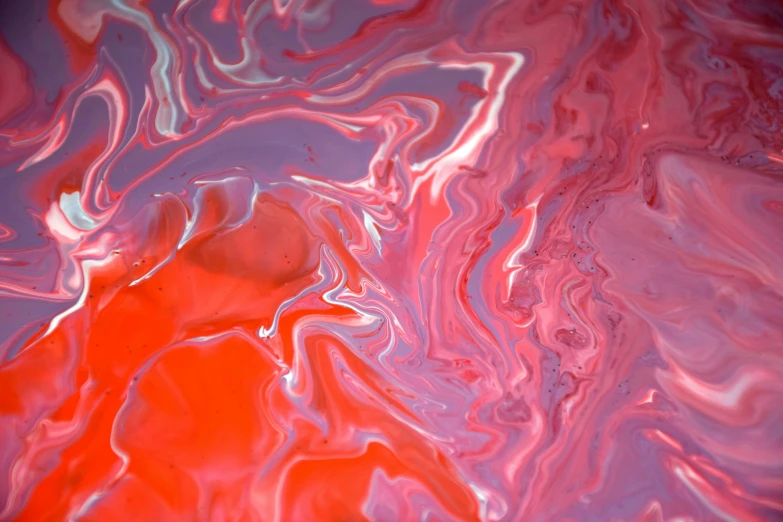 a large, red and pink abstract image with bright colors