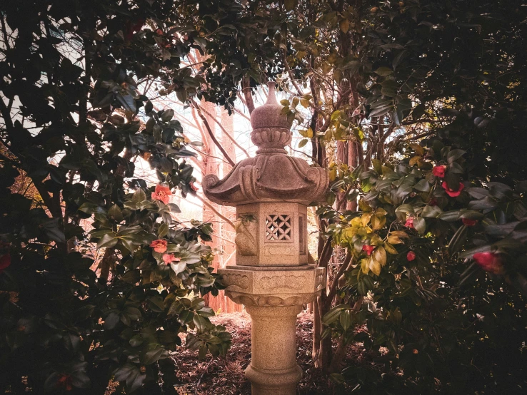 a decorative building in the middle of trees