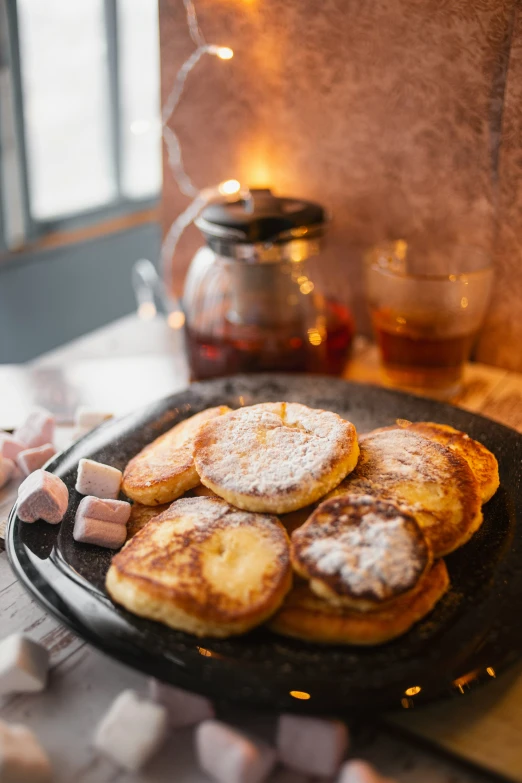 some little pancakes that have been placed on a plate