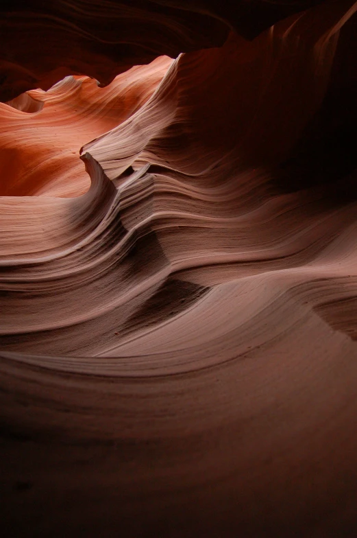 a large slot formation in the rock wall