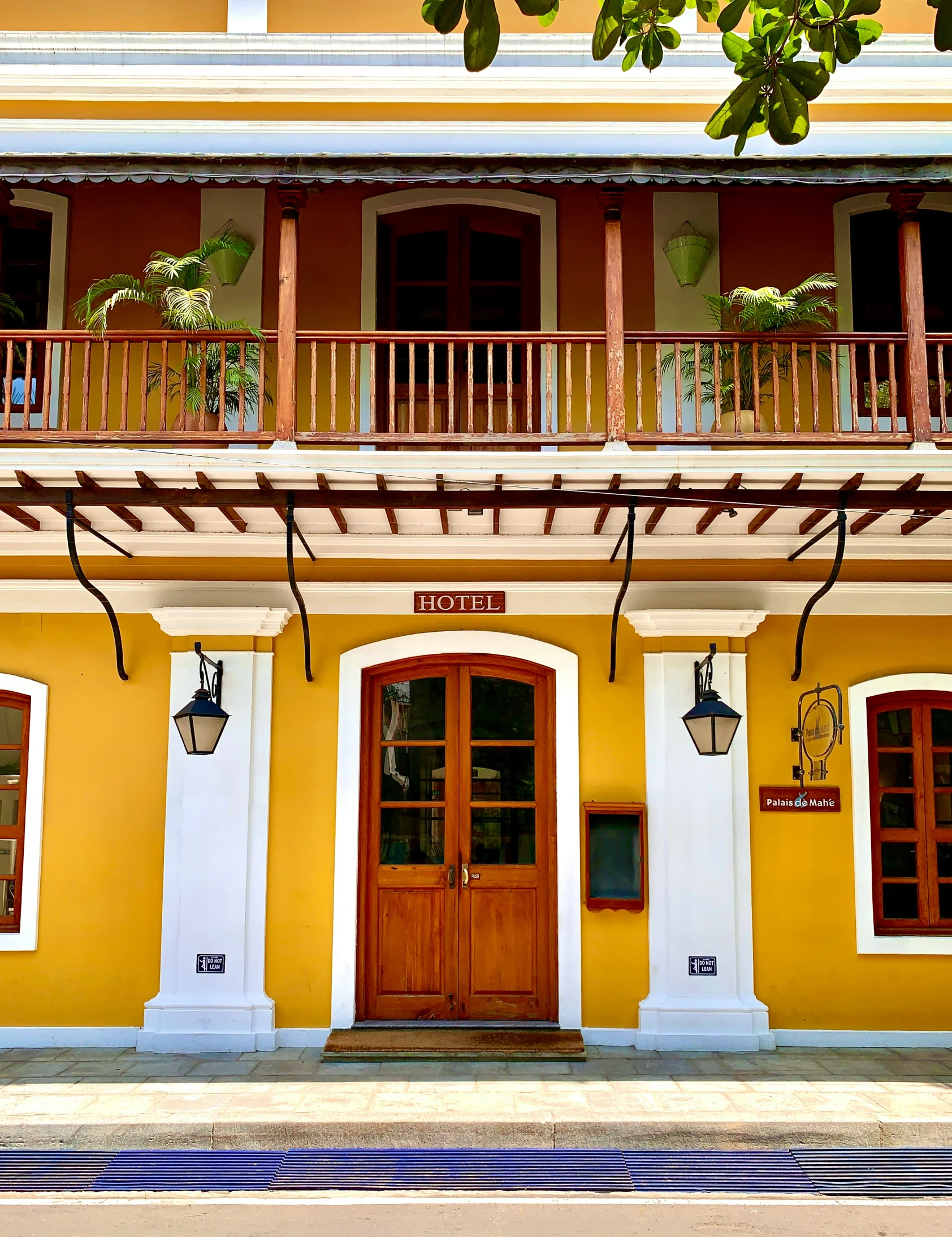 an ornate building with red doors and balconies