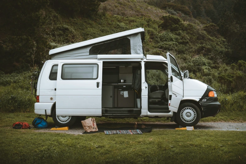 there is a white van parked in a field