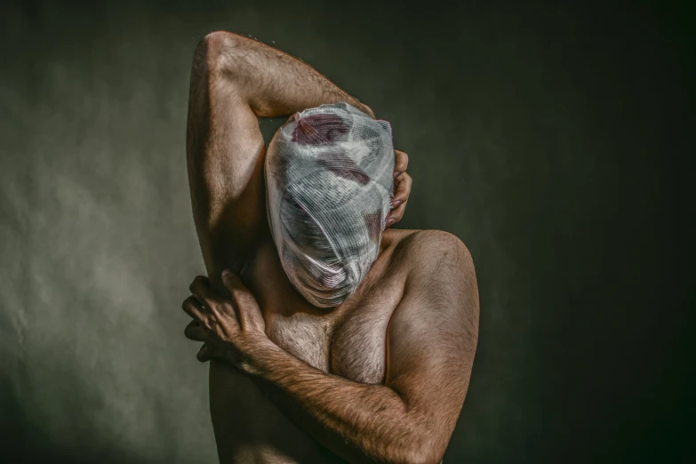  man with a bandaged face and half transparent mask