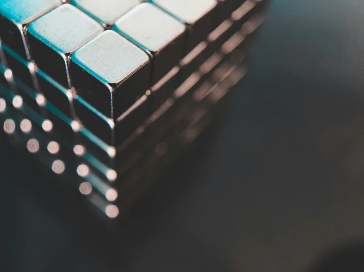 a cube made from small circles and blue tints