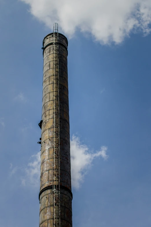 a tall, skinny tower with ladders down it