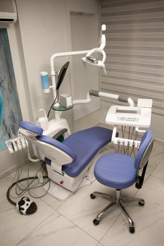 an open dental chair is shown in front of a mirror