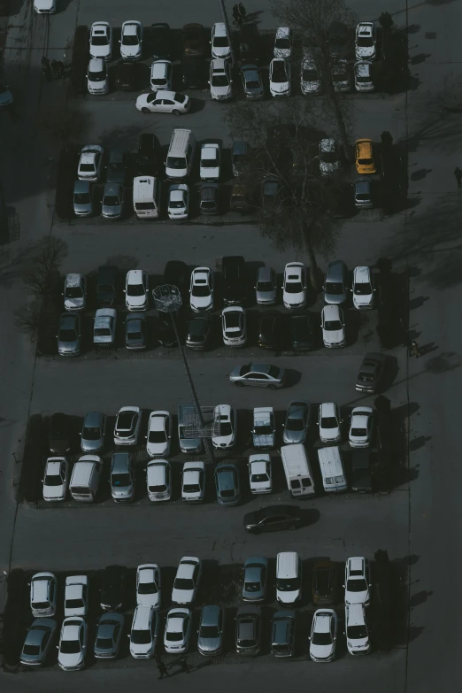 an aerial s of several parked cars in a parking lot
