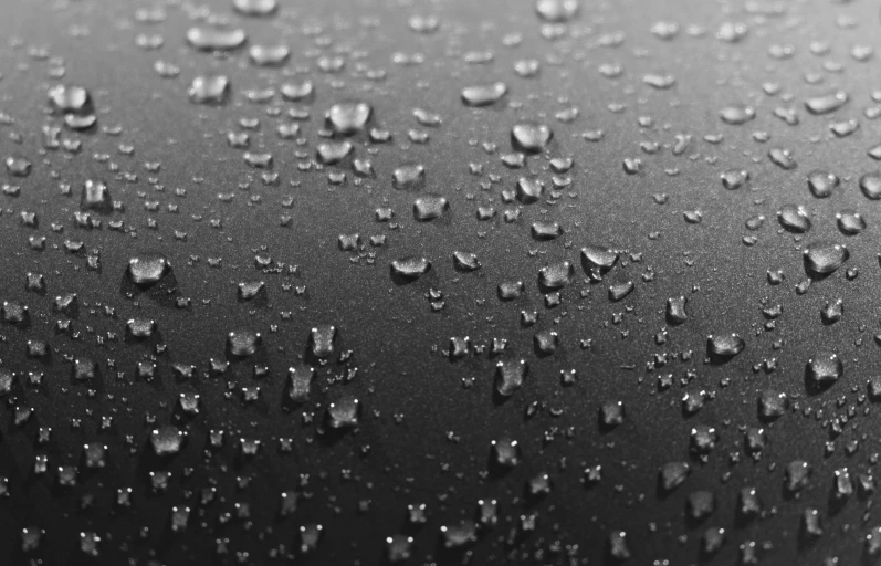 a black and white po of drops of rain