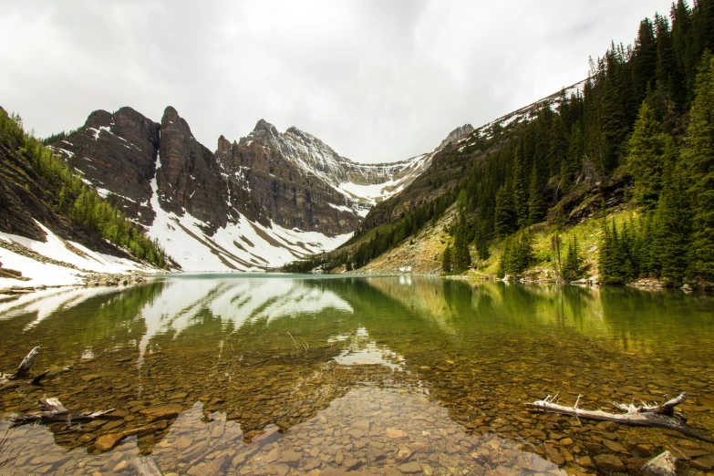 the mountains are surrounding a lake and mountain range