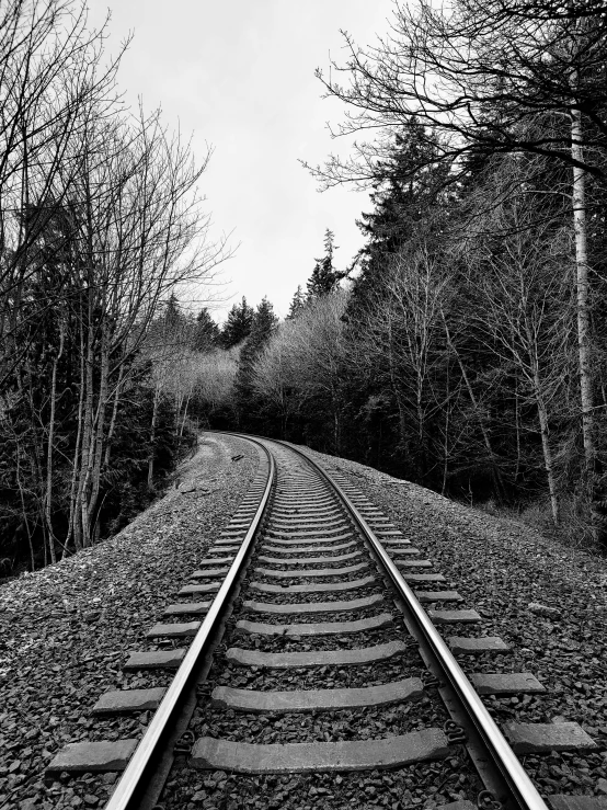 an old black and white po of a train track