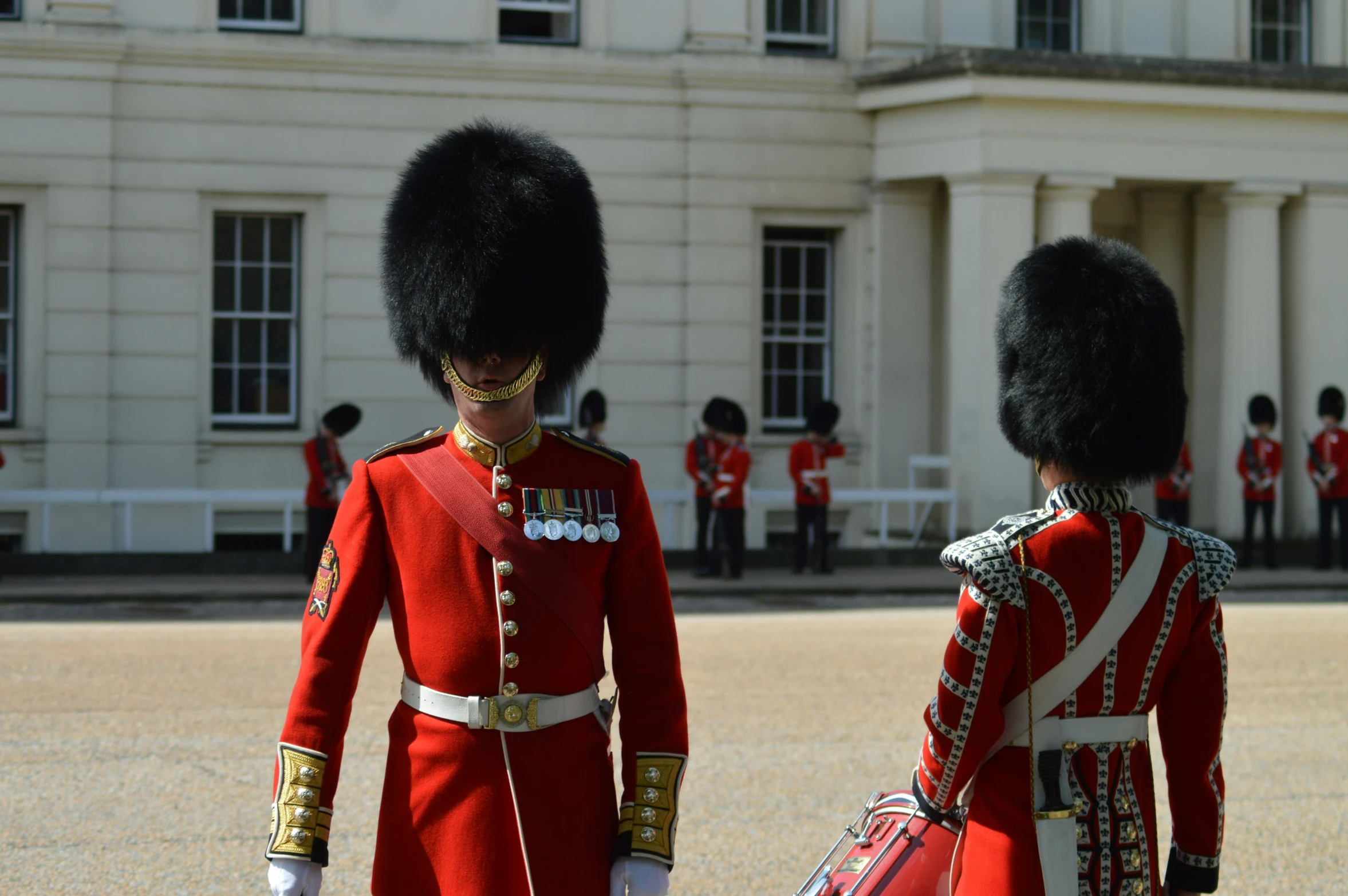 a group of soldiers dressed in red and white uniforms