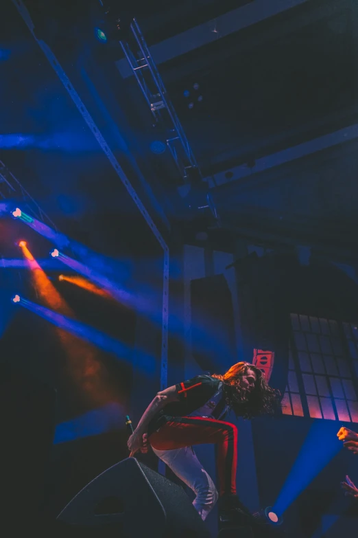 a group of people on stage playing on a giant monitor