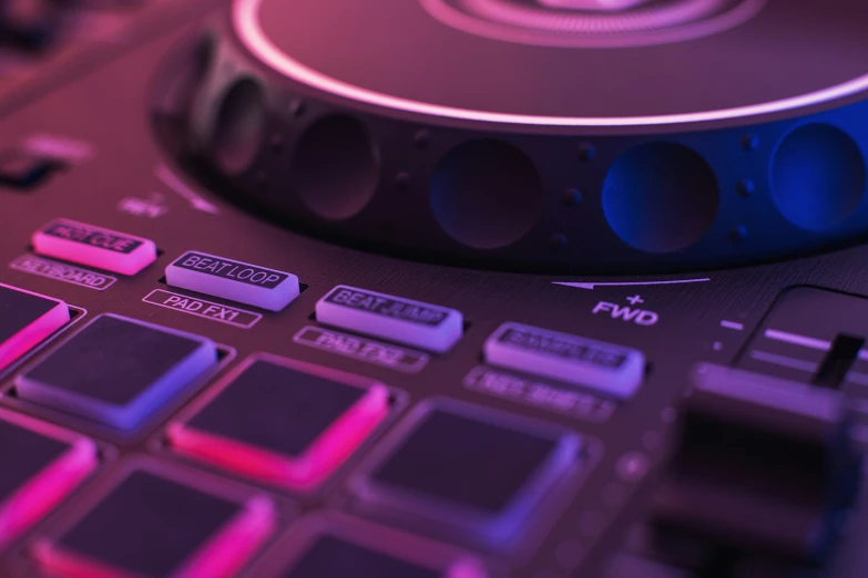 a close up po of a dj controller with a sound track on the side