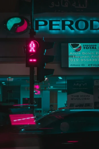 a red traffic light sitting next to a neon store