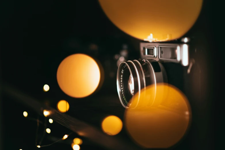 an old fashioned camera is shown with several yellow circles