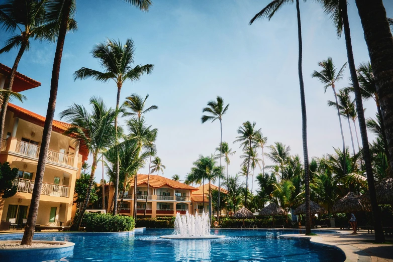 a pool and surrounding buildings on the resort property