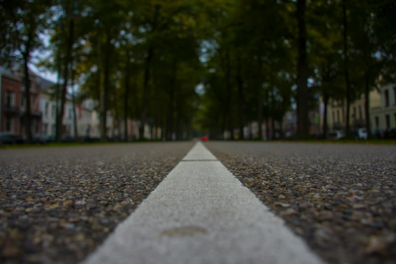 an empty road with no cars in the background