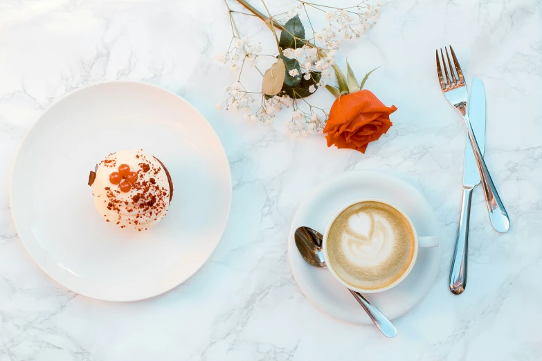 a plate with dessert and cup of coffee on it