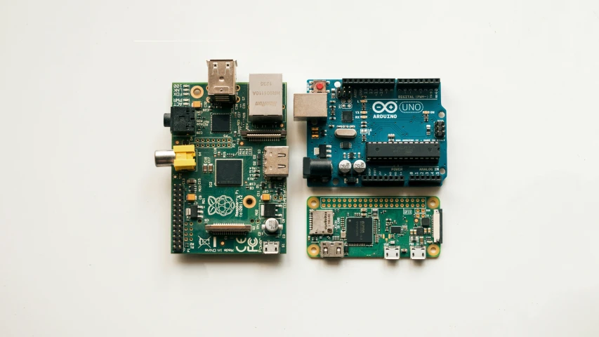 two pieces of electronic equipment on a white surface