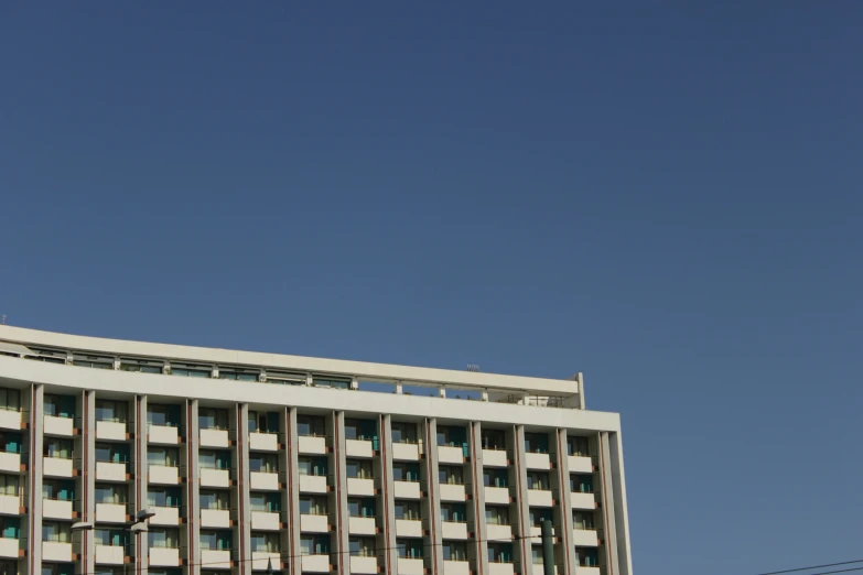 a large white building with a clock on top