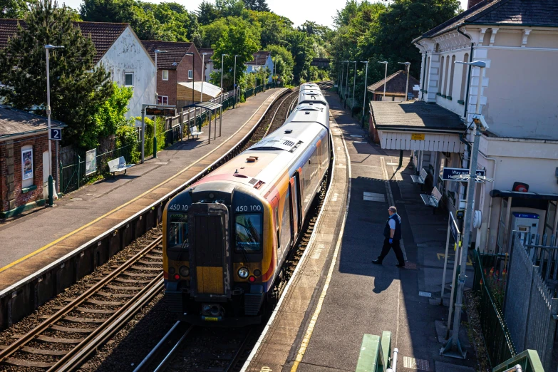 a train is passing by an elevated platform