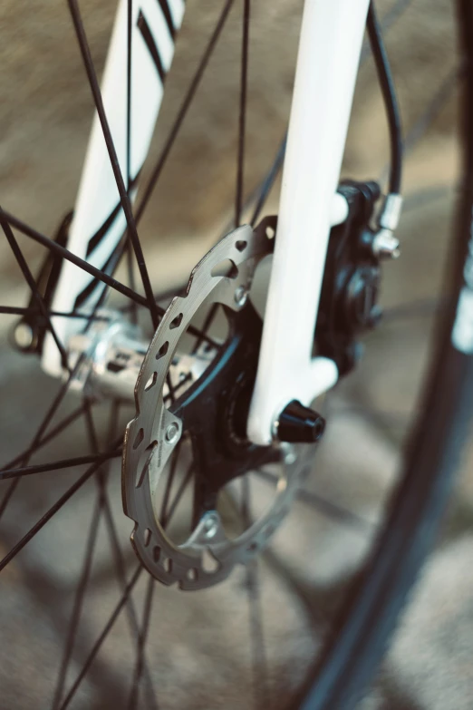 a bike that is laying on some dirt