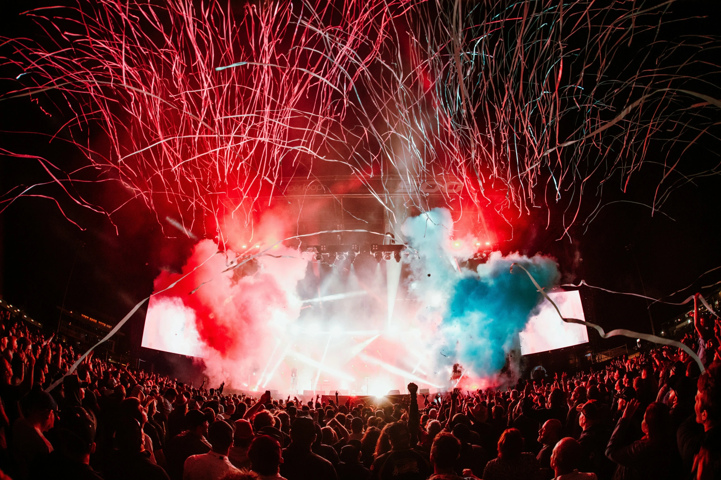 fireworks on the ground with a lot of people watching