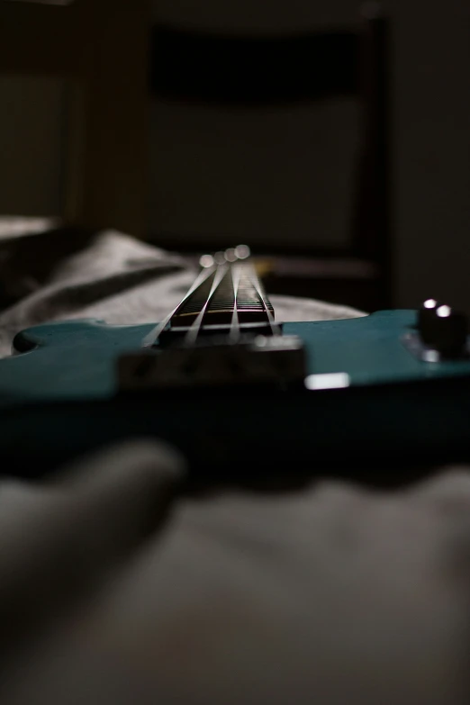 a close up of a blue guitar