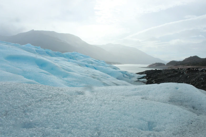 a group of pieces of ice on a beach