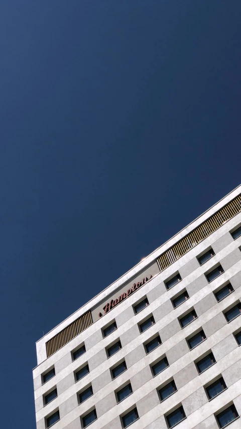 a picture of a white building looking up