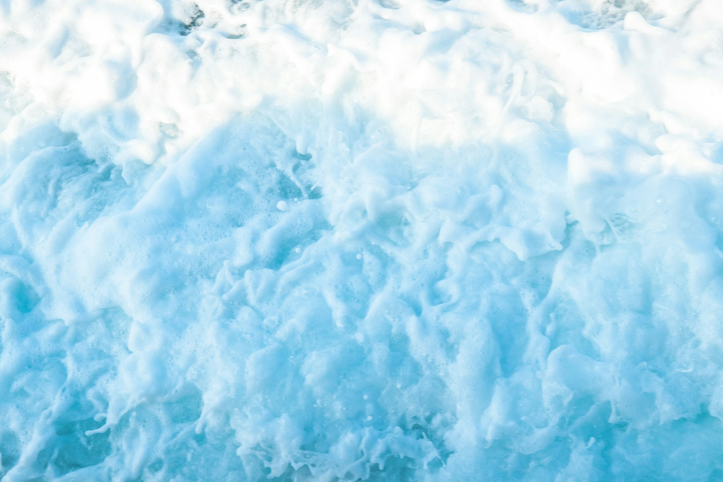 a view of the top of a water wave