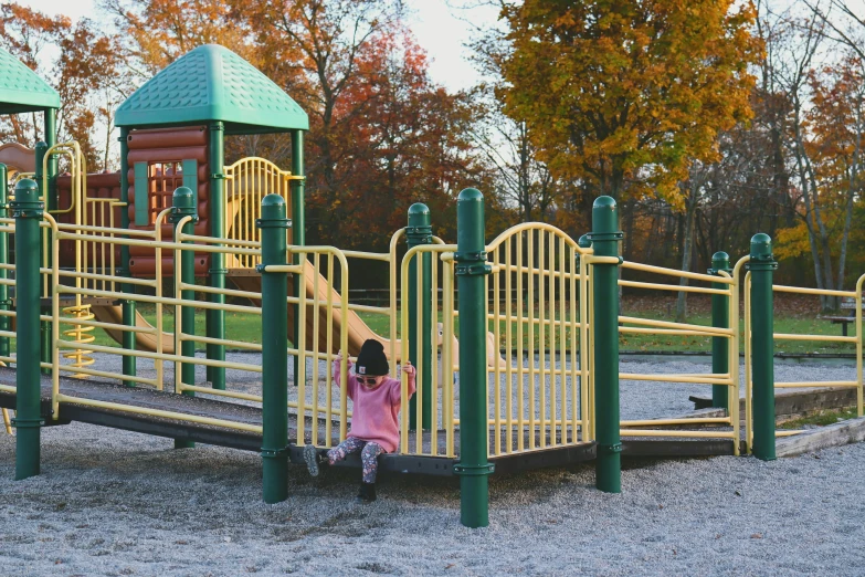 a  is sitting in a play park