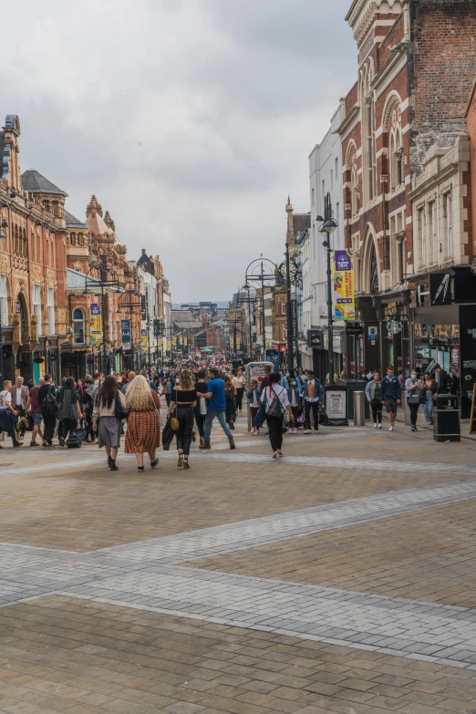 people walk on a busy, european city street