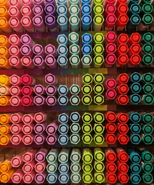a rainbow display filled with lots of different colors of pens