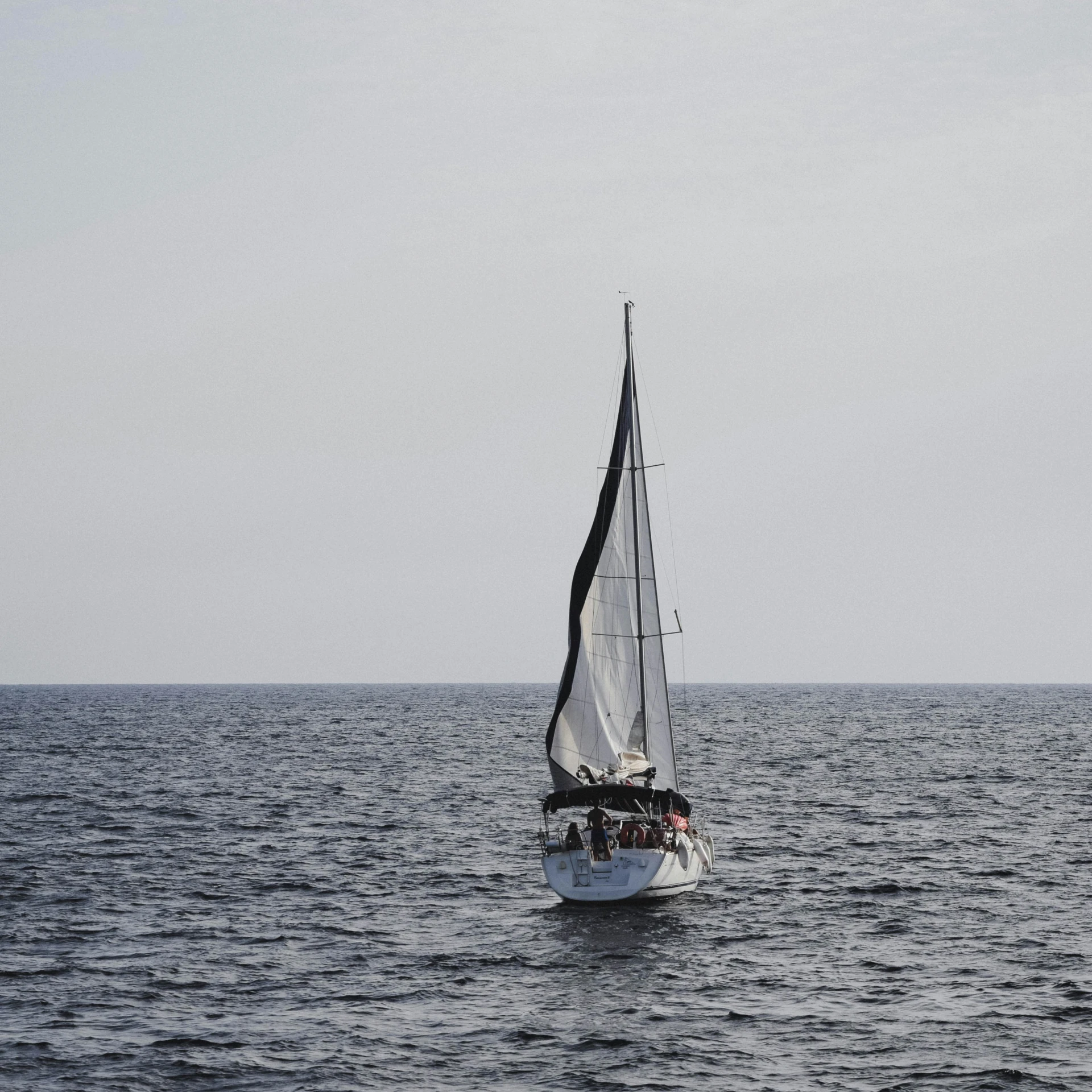 a sailboat in a calm body of water