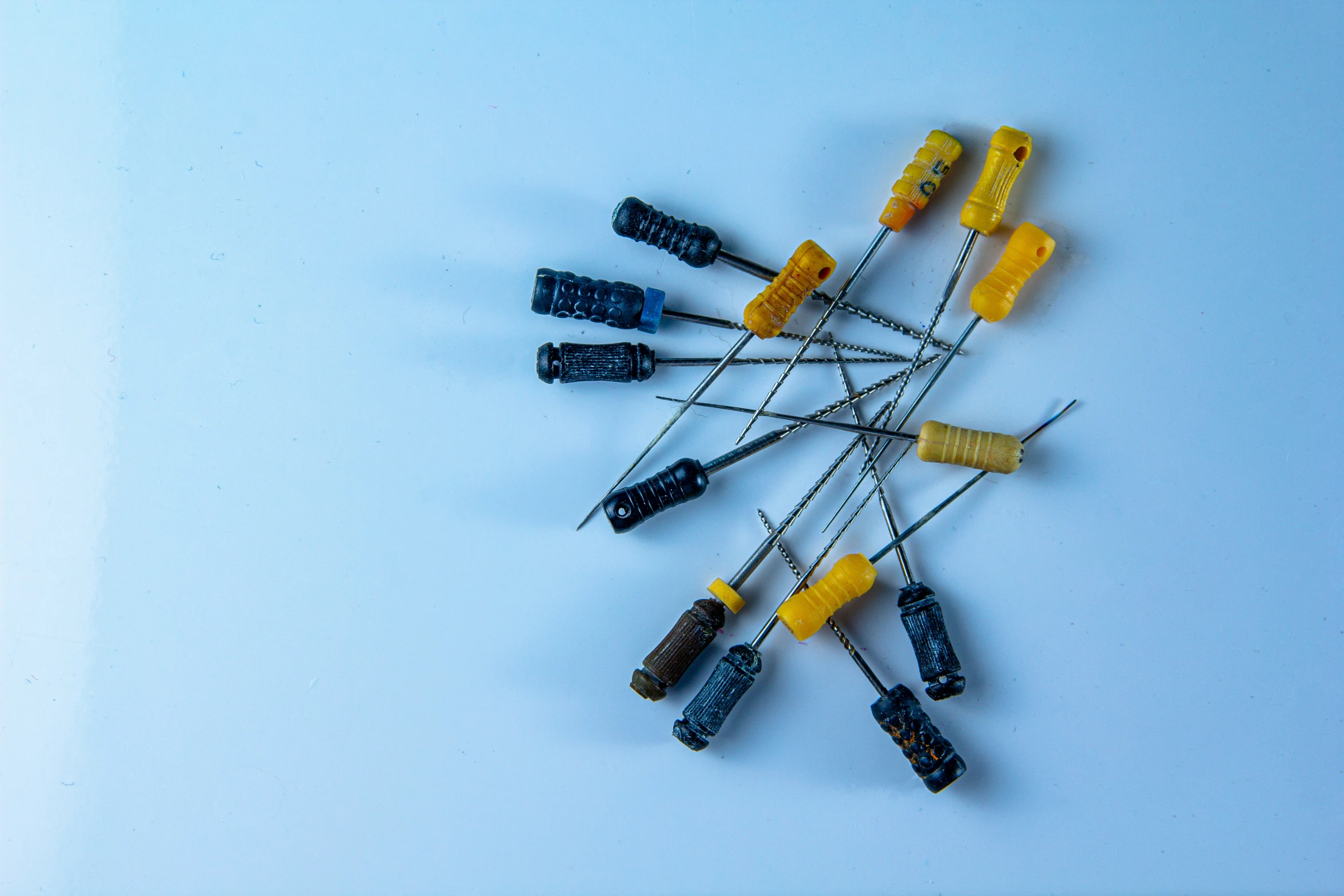 several toothbrushes with tooth paste arranged on them