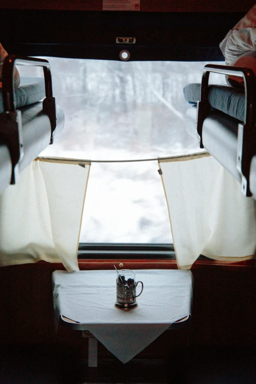 two chairs that are on the inside of a train