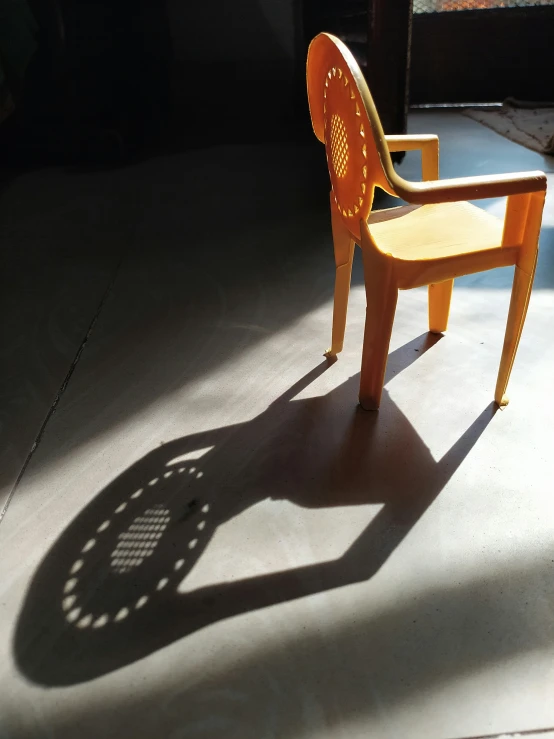 a chair on the ground near a building
