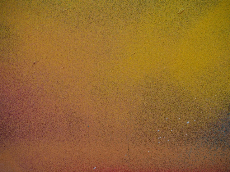 a picture of yellow and brown paint with a rusted border