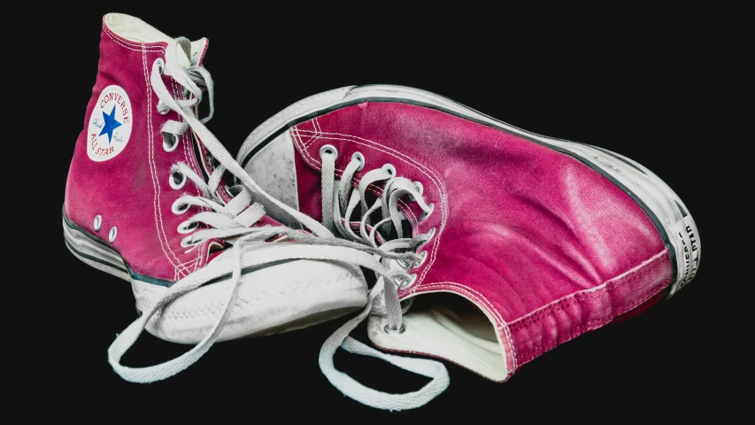 a pair of pink converses in their white outs