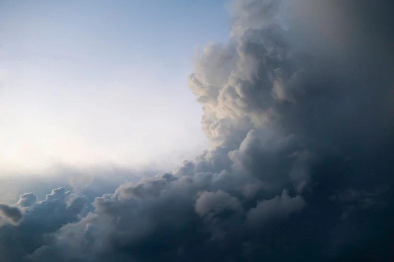 the sky is filled with some very large clouds