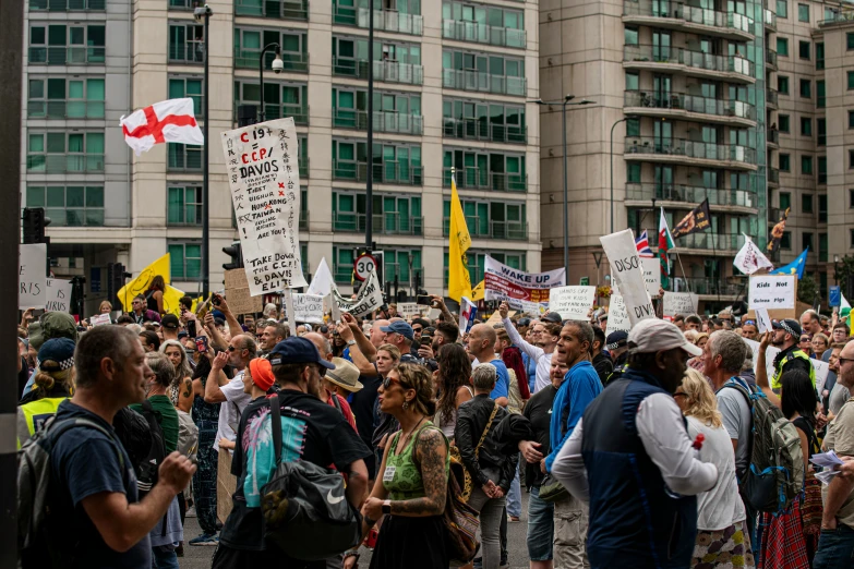 a large group of people in a city protesting a right turn act