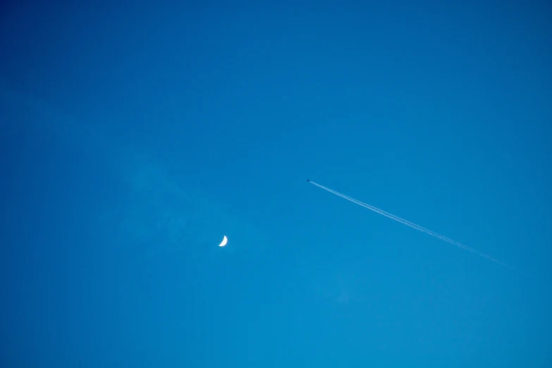 a sky view with no clouds and the moon