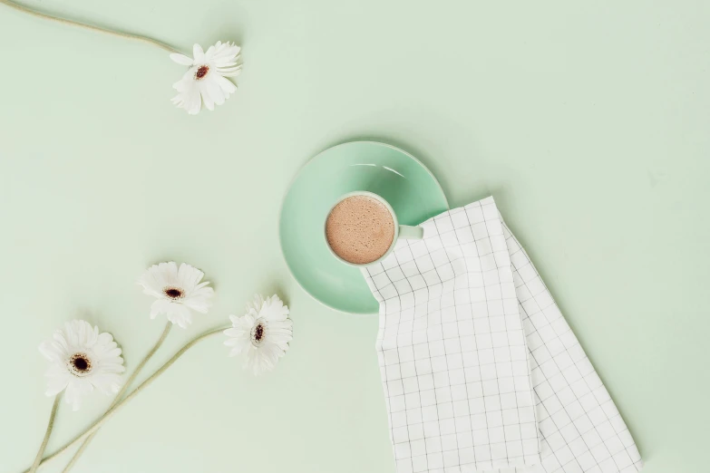 a bowl with a flower and napkin on top