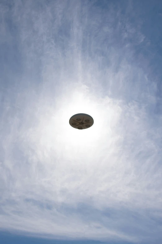 a large object floating in the sky during daytime