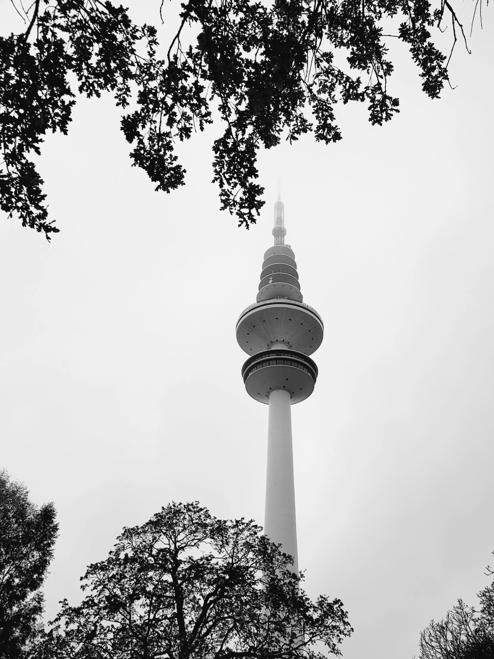 a view of the tower with trees in the background