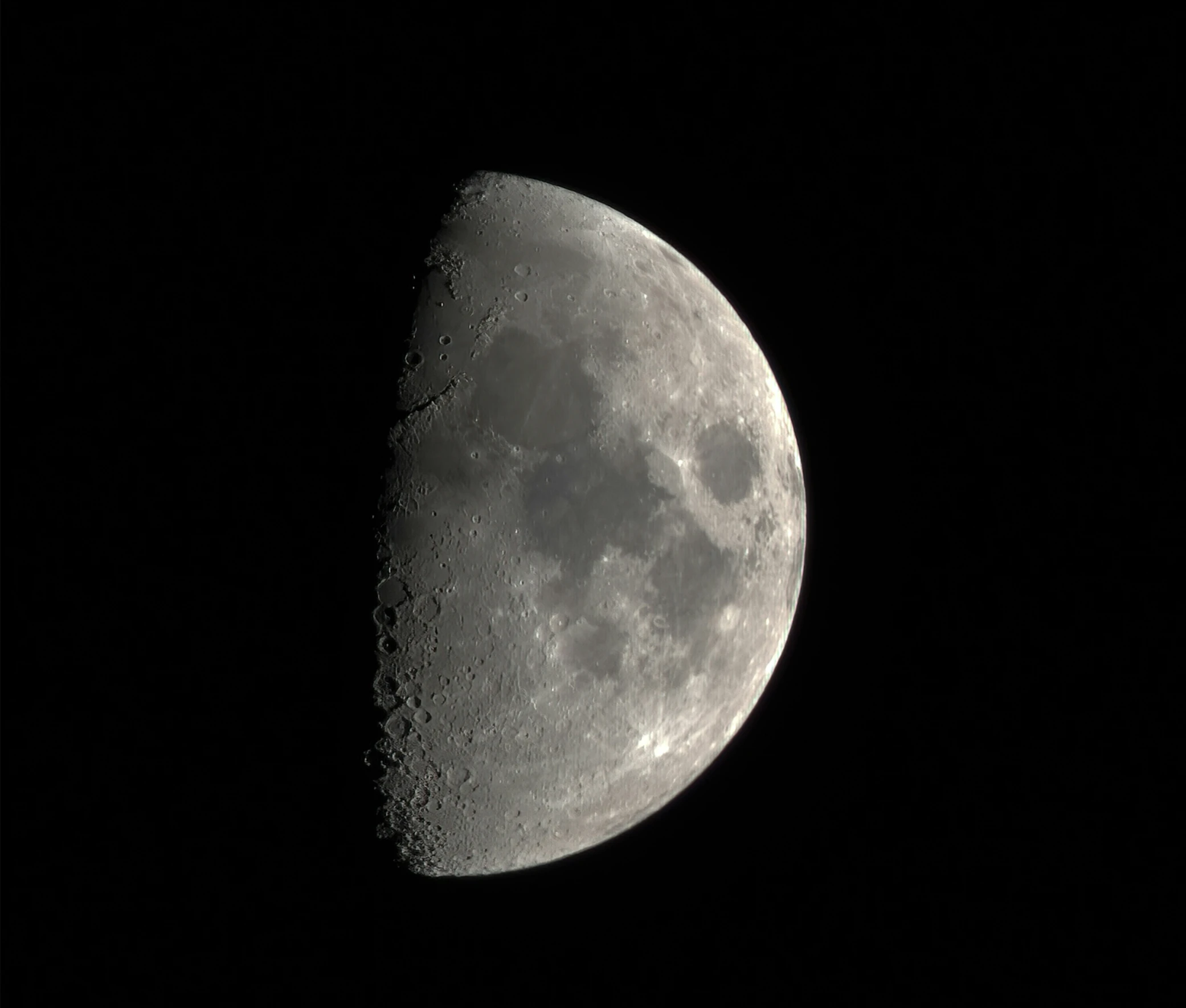 the moon from the black background looks to be slightly dark