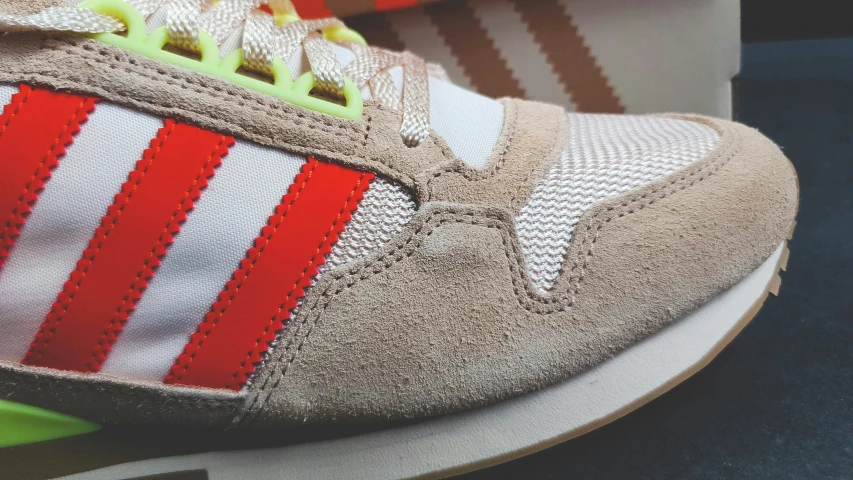 closeup on an adidas sneakers'reflective toe and outsocks
