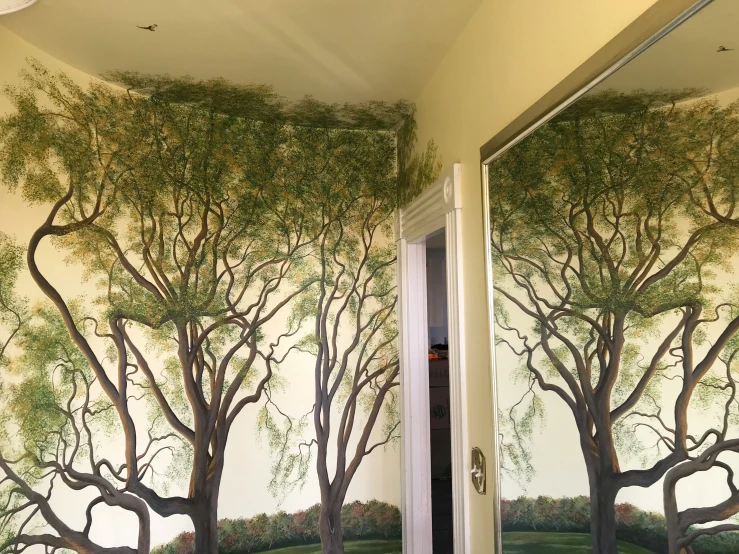 the doorway way is decorated with wallpaper designs and murals