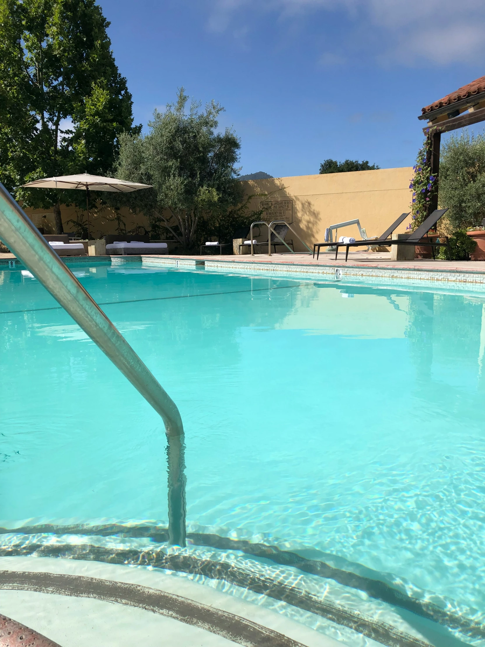 a pool filled with lots of clear blue water